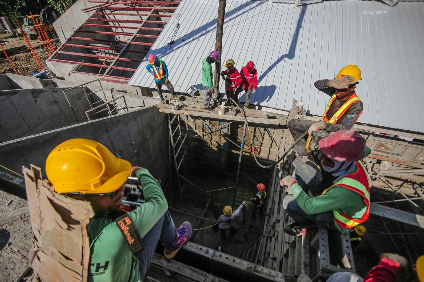 Site team in helmets and high-visibility vests