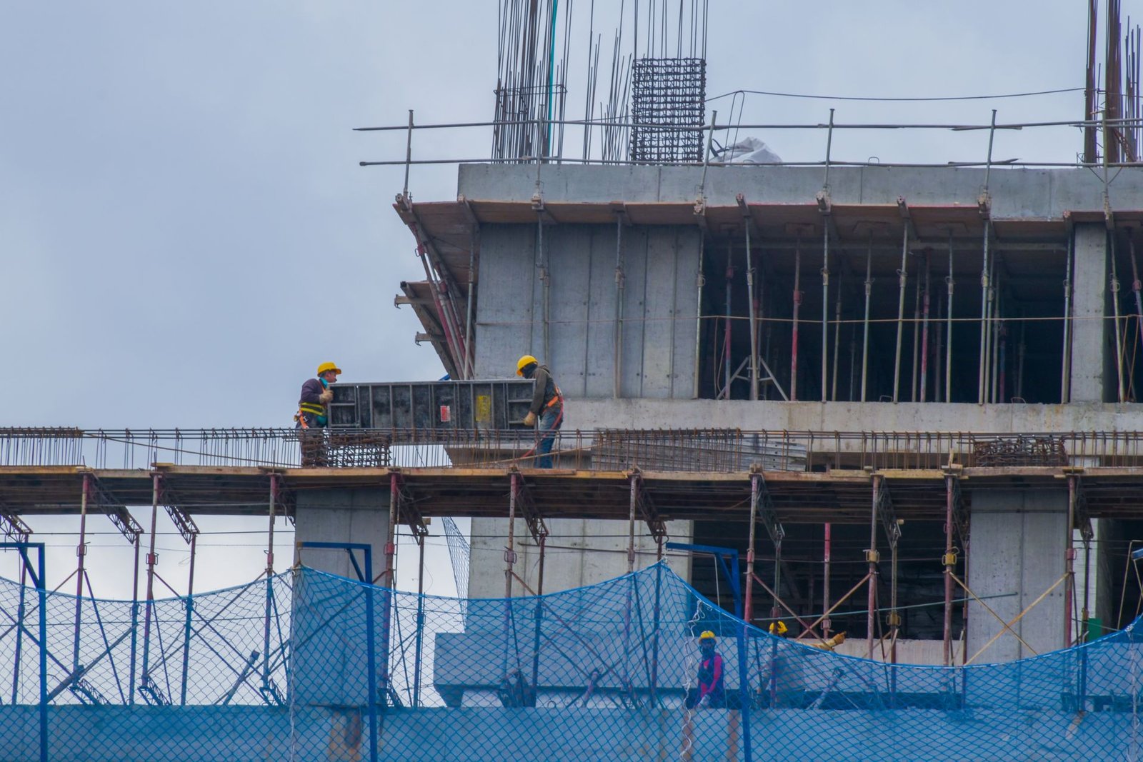 Workers on scaffolding at a building under construction
