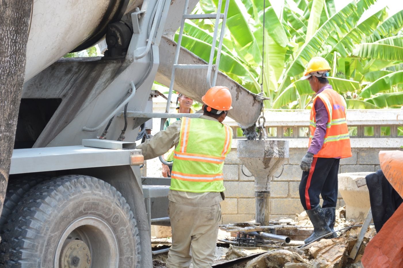 Concrete being poured on site from a truck chute